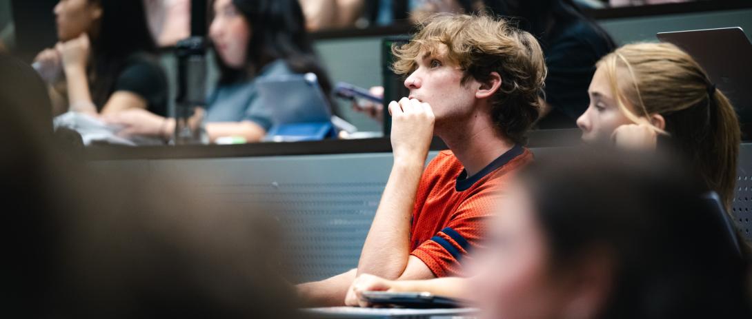 A students listens to a lecture.